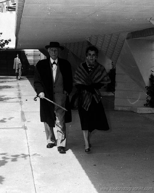 20-23-wright3-ws Frank Lloyd Wright with wife Olgivanna walking in the Esplanade leading from E. T. Roux Library to Annie Pfeiffer Chapel c. 1950